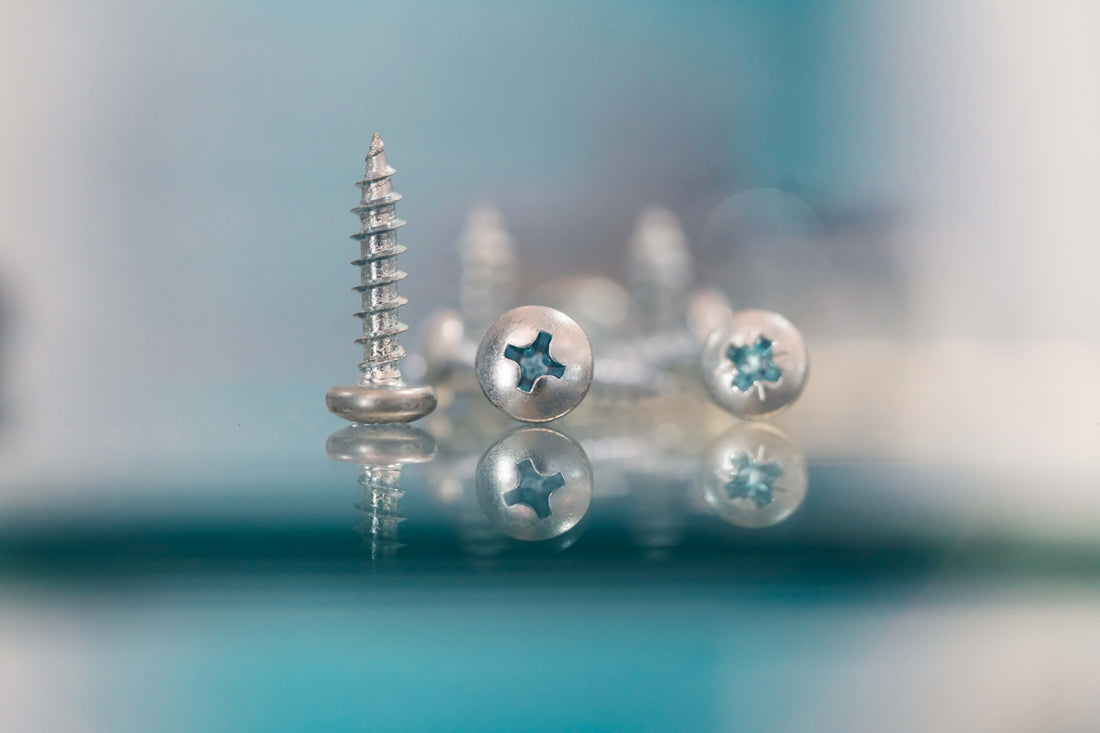 a group of screws sitting on top of a table
