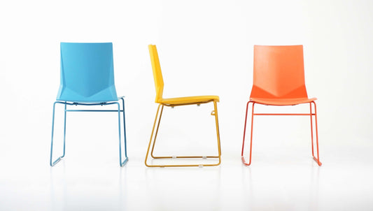 a group of three chairs sitting next to each other