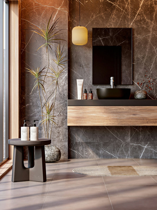 Elegant bathroom with marble walls and natural elements.