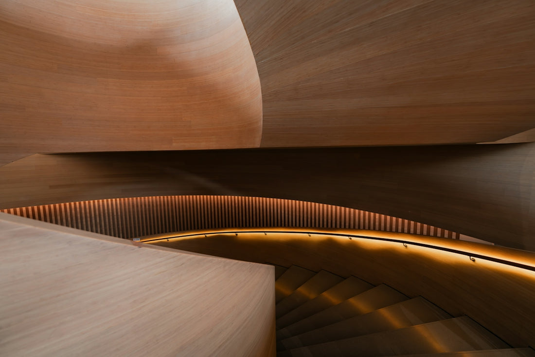 Modern wooden staircase with warm ambient lighting