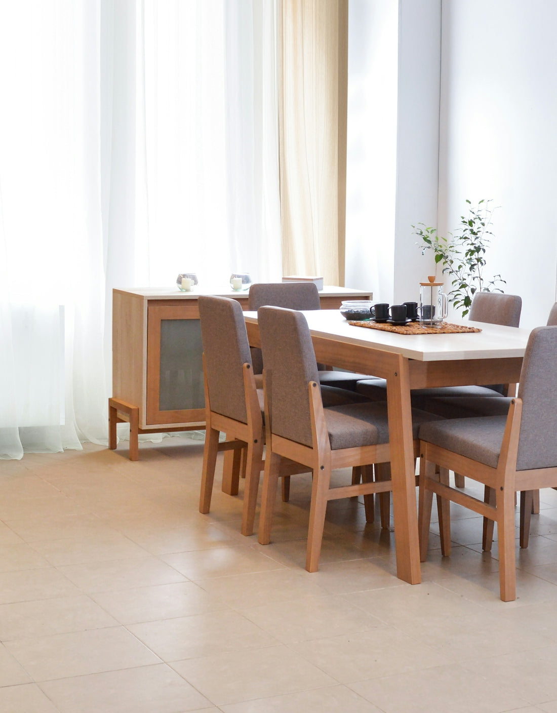 Dining table with chairs in a bright, modern room