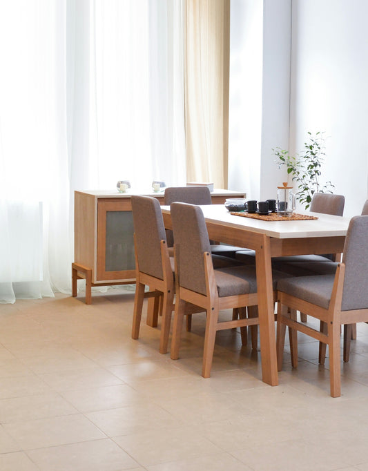 Dining table with chairs in a bright, modern room