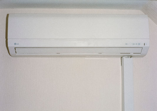 A white air conditioner mounted on a wall.