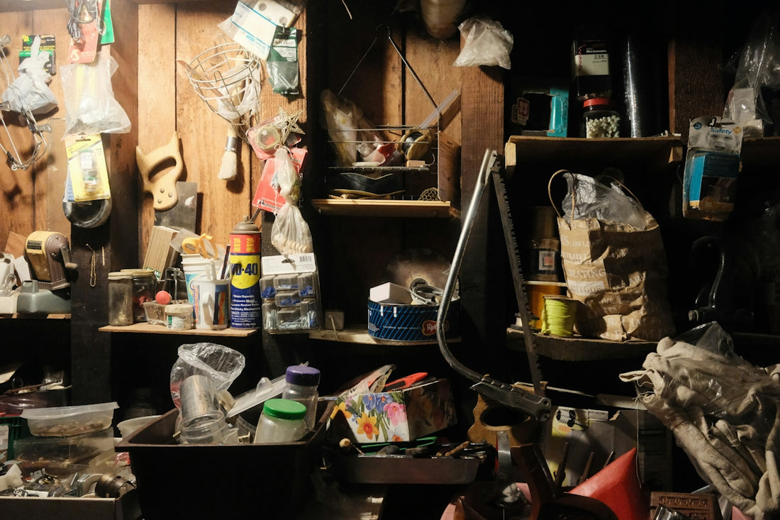 Messy, cluttered storage room filled with various household items