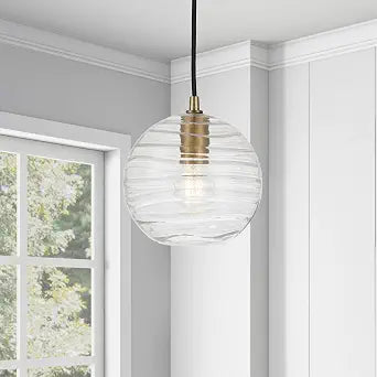 Wayve 8" Wide Textured Pendant with Glass Shade in Brass/Clear