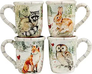 Winters Walk Set of 4 Ceramic Mugs  Enjoy hot cocoa, tea, or coffee in these delightful 16oz mugs adorned with foxes, owls, and raccoons, adding a touch of winter wonder to your mornings
